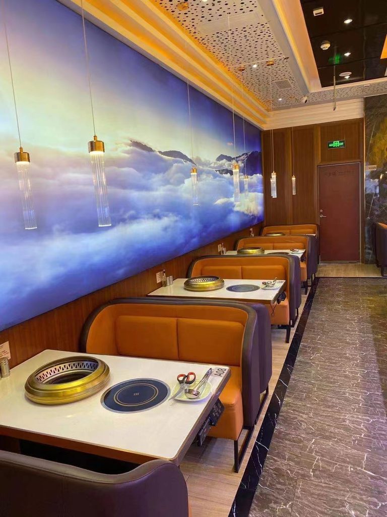 Smokeless BBQ tables in an indoor Korean BBQ restaurant