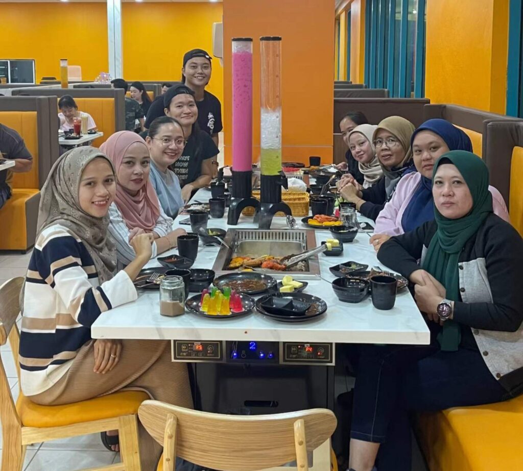 Customers enjoying Korean BBQ at a smokeless BBQ table